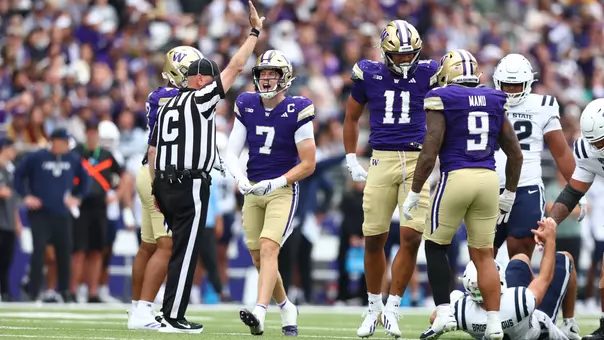Alex McLaughlin and the Husky defense celebrate against Utah State