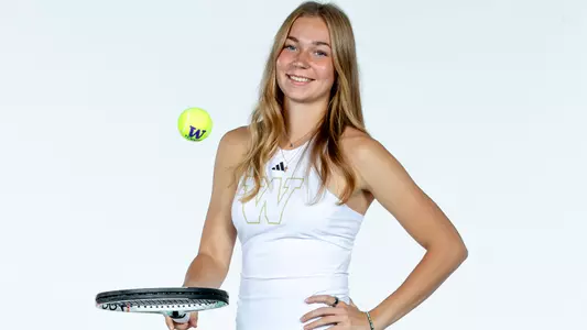 Marina Markina bounces the ball on her racquet during media day