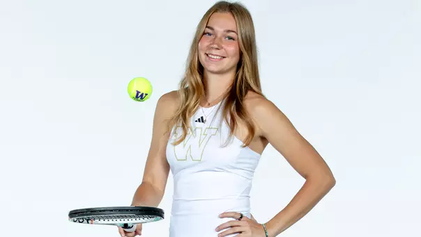 Marina Markina bounces the ball on her racquet during media day