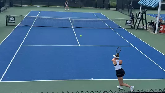 Marie Weisseheim return a serve during day one of pre-qualifying at the ITA All-American Championships
