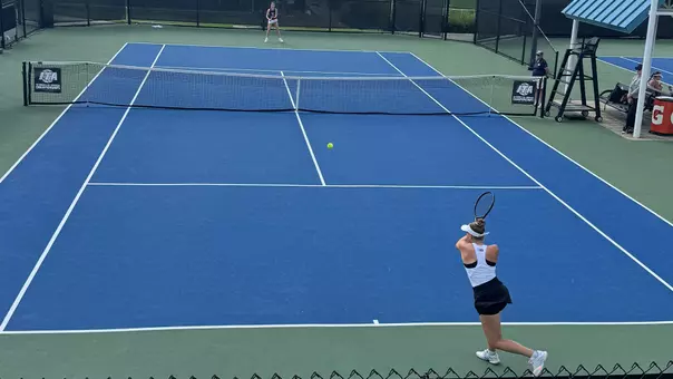 Marie Weisseheim return a serve during day one of pre-qualifying at the ITA All-American Championships