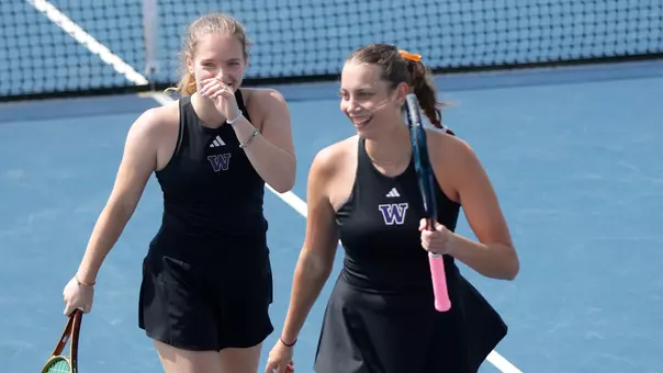 Alexia Jacobs and Marie Weissheim smile in between doubles points