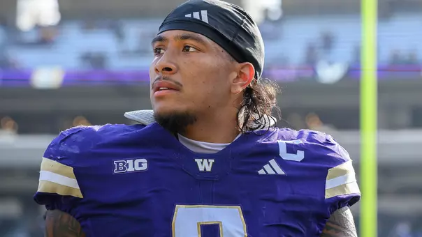Jacob Manu stands on the sideline against Eastern Washington