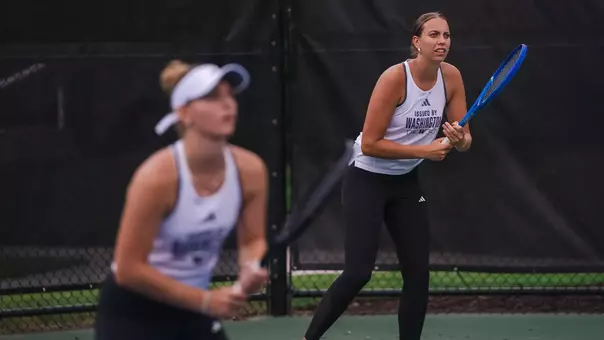 Alexia Jacobs and Marie Weissheim prepare for doubles in the Round of 16 at the ITA All-American Championships