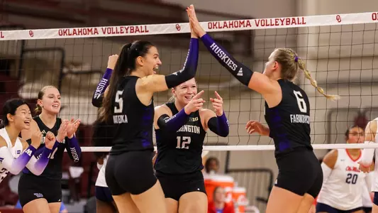 Mateska and Fabikovicova high-five after a point in Oklahoma