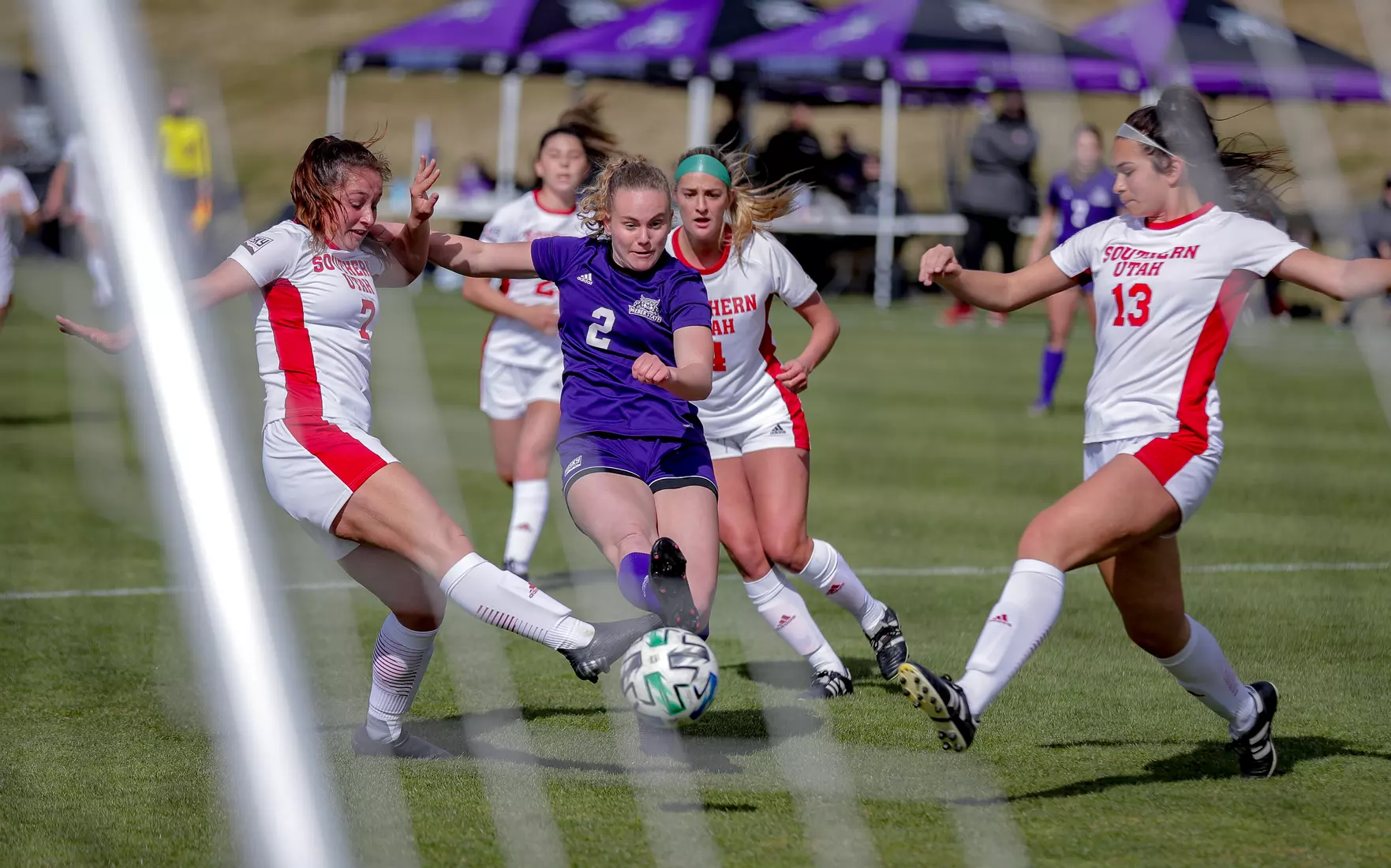 Yira Yoggerst beats two Thunderbird defenders to shoot and score.