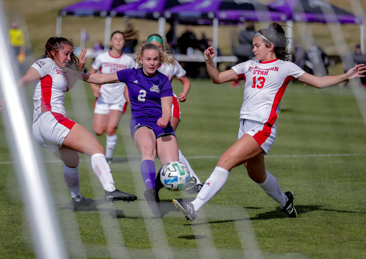 Yira Yoggerst beats two Thunderbird defenders to shoot and score.