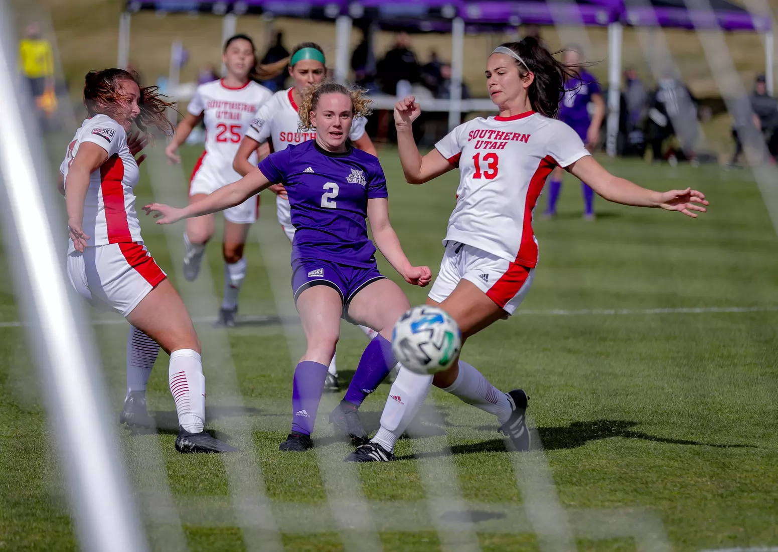 Yira Yoggerst beats two Thunderbird defenders to shoot and score.