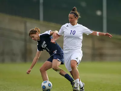 'Cats top Wolverines for first win