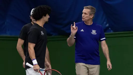 Brad Ferreira coaching two players against BYU in 2024