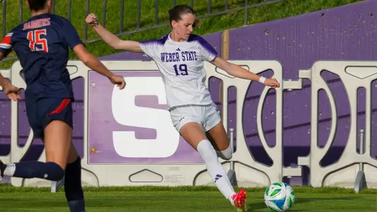 Oakley Anderson strikes a cross against Snow College
