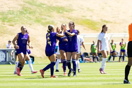 Weber State soccer players celebrating a goal