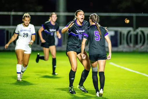 Wildcat soccer players celebrating