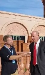 Head Coach Jeff Brohm is interviewed outside Atlantis.