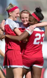 WKU soccer players embrace after a goal