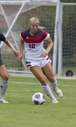 Iris Dunn dribbles around a Xavier defender