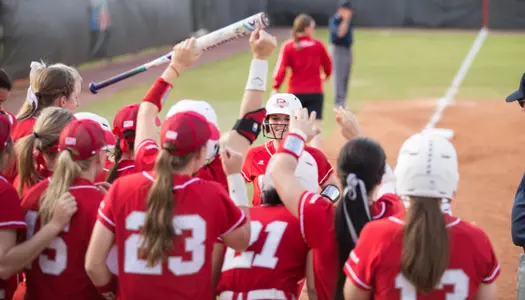 Paige Carter home run team huddle celebration