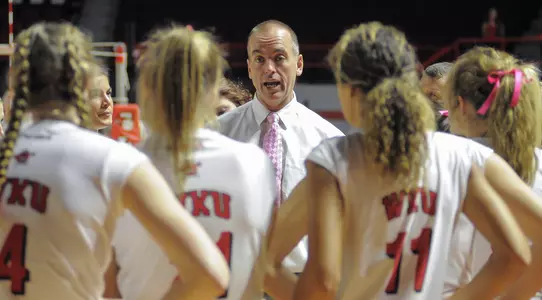 Travis Hudson huddle