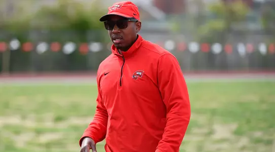 Head coach Erik Jenkins track cross country xc