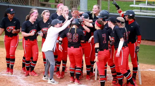 Paige Carter home run team celebration