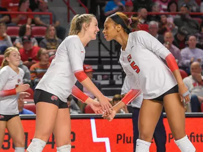 Setter Callie Bauer (14) and Middle hitter Lauren Matthews (5) of the WKU Hilltoppers at E. A. Diddle Arena on October 9, 2022 in Bowling Green, KY. Photo by Steve Roberts/WKU Athletics