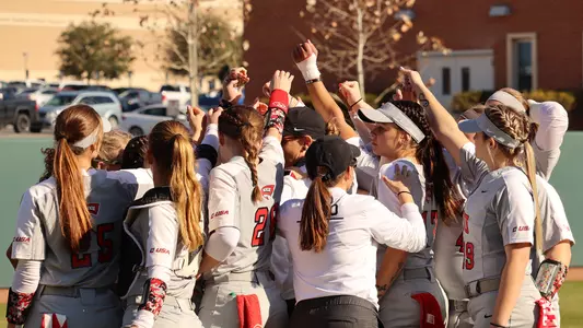 WKU Softball team huddle 2.11.22