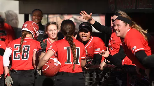WKU Softball dugout team celebration
