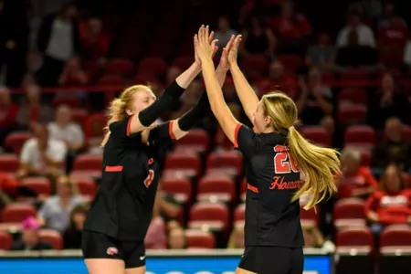 Outside hitter Kaylee Cox (8) and outside hitter Katie Howard (26) of the WKU Hilltoppers at E. A. Diddle Arena on October 21, 2023 in Bowling Green, KY. Photo by Steve Roberts/WKU Athletics