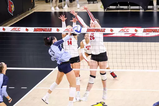 Setter Callie Bauer (14), Middle hitter Izzy Van De Wiele | Photo by Savannah Philpot
