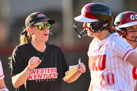 Head coach Amy Tudor and Infielder Charlotte Herron (20) | Photo by Steve Roberts