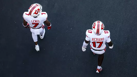 File photo featuring safety Jaylen Lewis and safety Dave Herard walking on the field during the 2025 season.