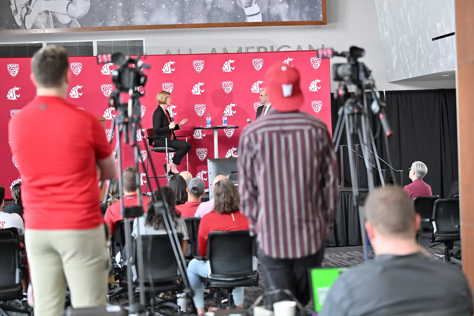 Behind the scenes shot of the Sofie Aagaard introductory event, taken behind the tv cameras looking on stage.