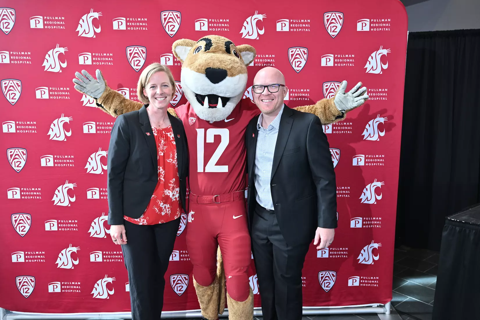 Sofie Aagaard (left) and husband Christian (right) takes a photo with Butch T. Cougar in the middle