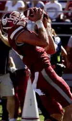 Cougars Drop Contest To Trojans, 50-16