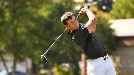 Io Palmer with students and environmental portrait in Ceramics studio