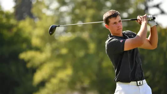 Io Palmer with students and environmental portrait in Ceramics studio