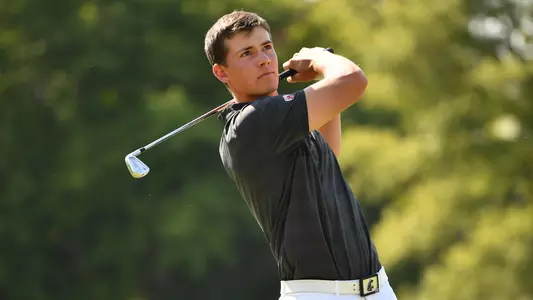 Io Palmer with students and environmental portrait in Ceramics studio