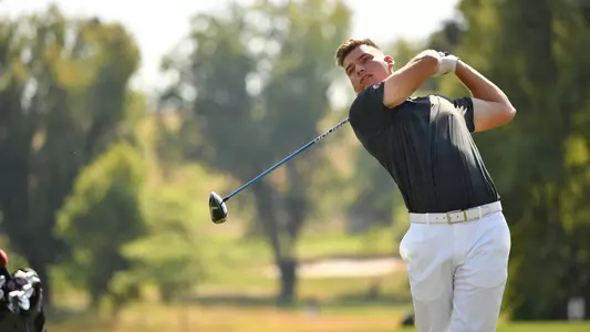 Io Palmer with students and environmental portrait in Ceramics studio