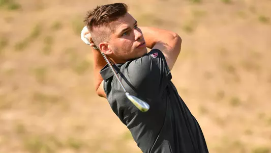 Io Palmer with students and environmental portrait in Ceramics studio