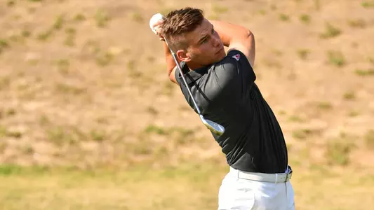 Io Palmer with students and environmental portrait in Ceramics studio