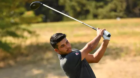 Io Palmer with students and environmental portrait in Ceramics studio