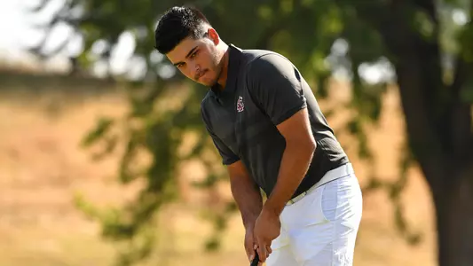 Io Palmer with students and environmental portrait in Ceramics studio