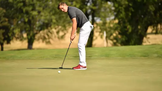 Io Palmer with students and environmental portrait in Ceramics studio