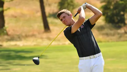 Io Palmer with students and environmental portrait in Ceramics studio