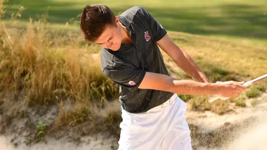 Io Palmer with students and environmental portrait in Ceramics studio