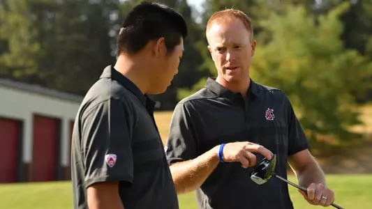 Io Palmer with students and environmental portrait in Ceramics studio
