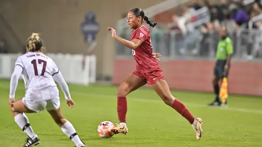 Aaqila McLyn dribbles through the ASU midfield