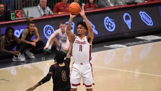 DJ Rodman shoots over a Texas State defender