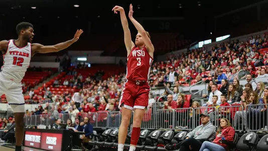 Jabe Mullins shoots over a Detroit Mercy defender