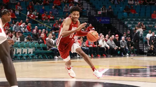 Carlos Rosario drives against UNLV